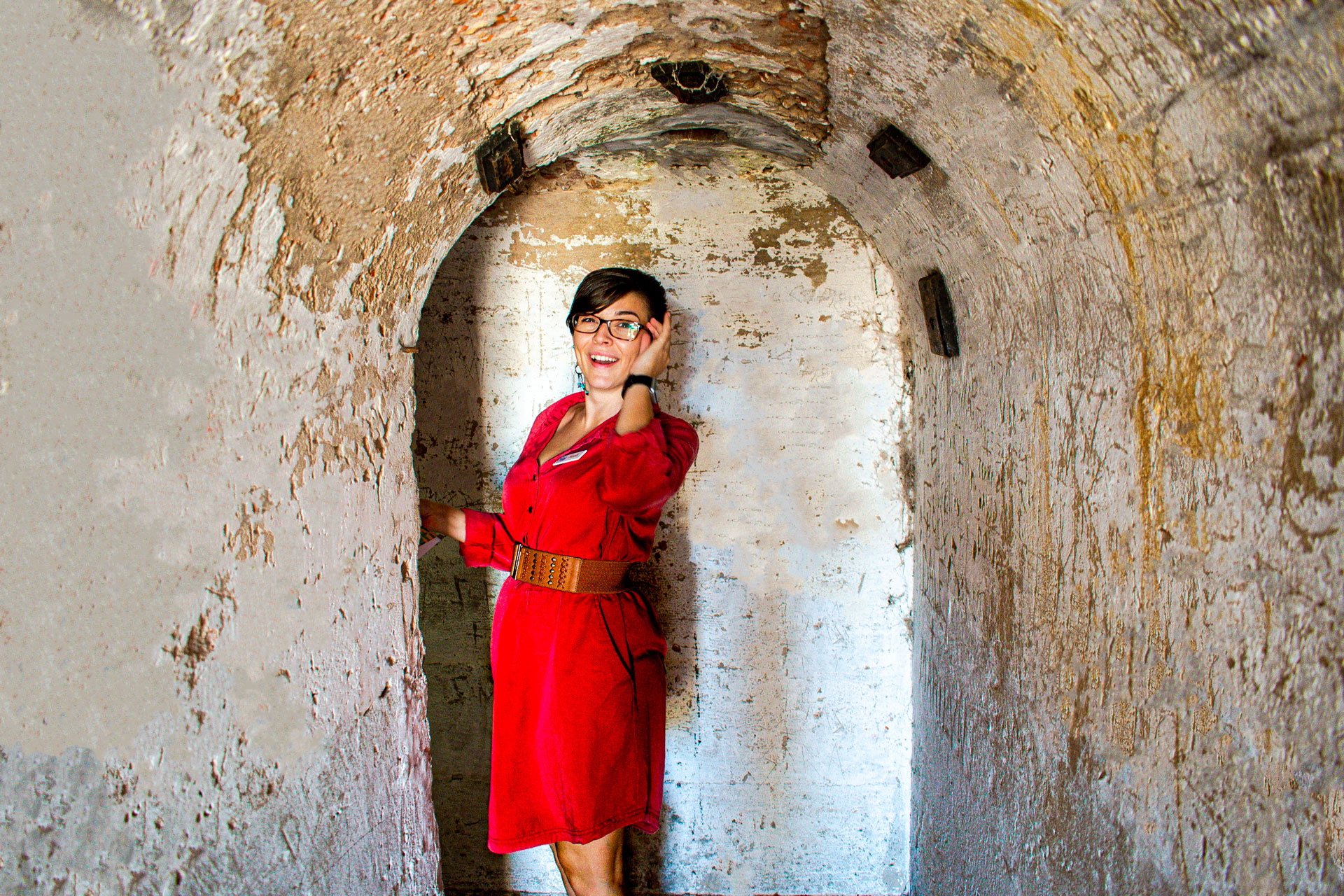 Sarah smiling at camera in a tunnel