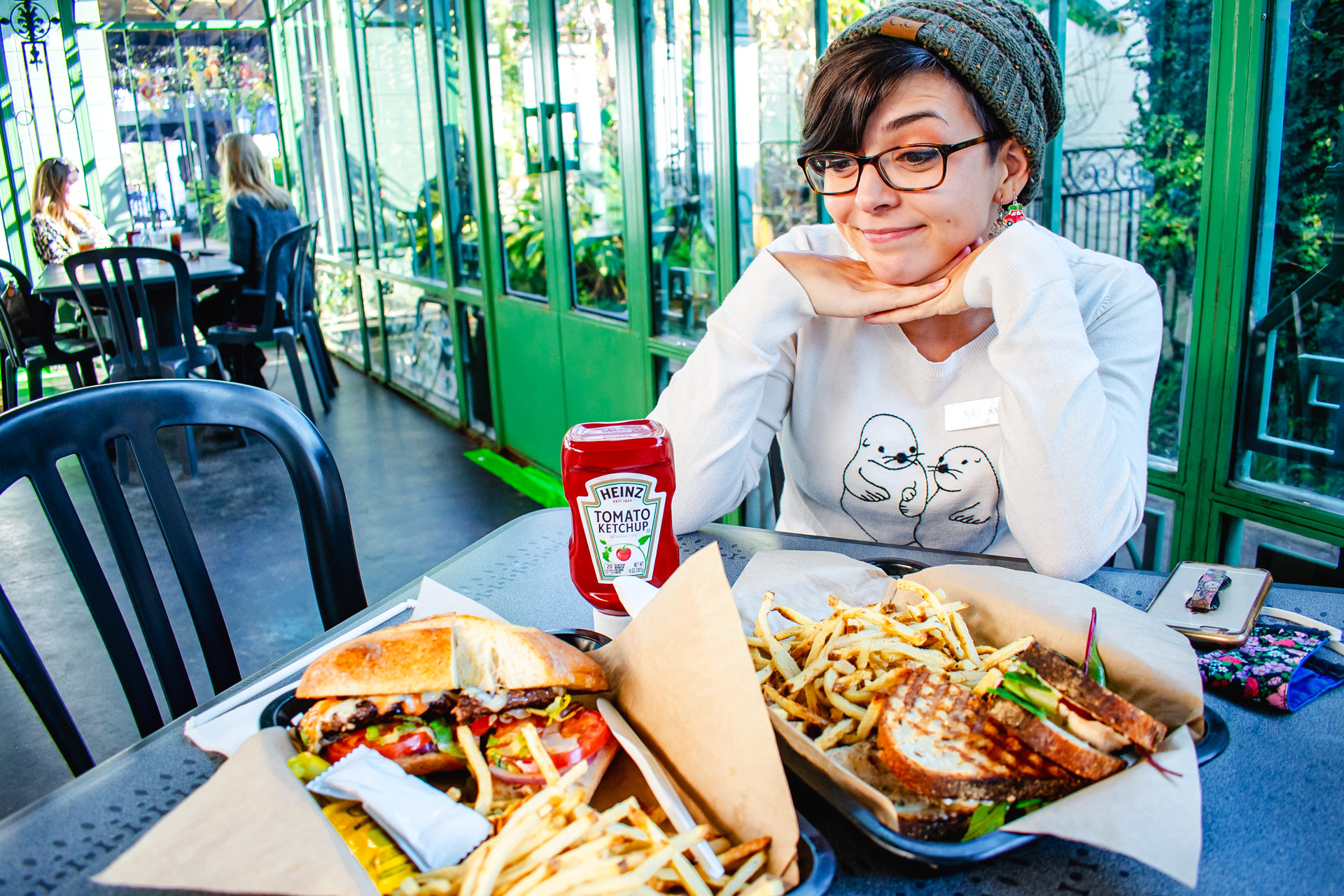 Sarah staring at her food from Panini Pete's with love