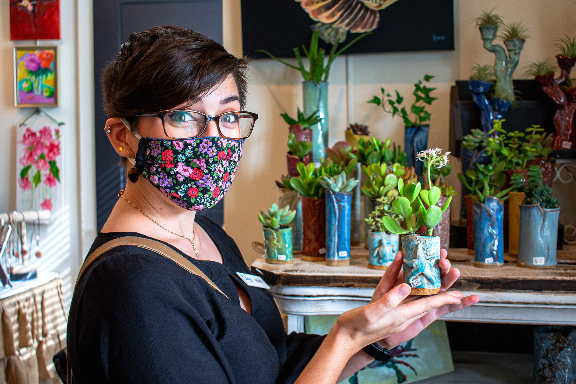 Sarah with handmade Pottery and plants